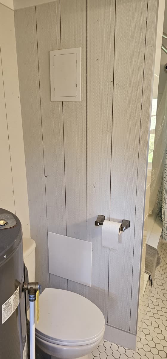 Kitchen renovation — butcher block countertops, patterned tile backsplash, navy cabinetry · Salt Spring Island