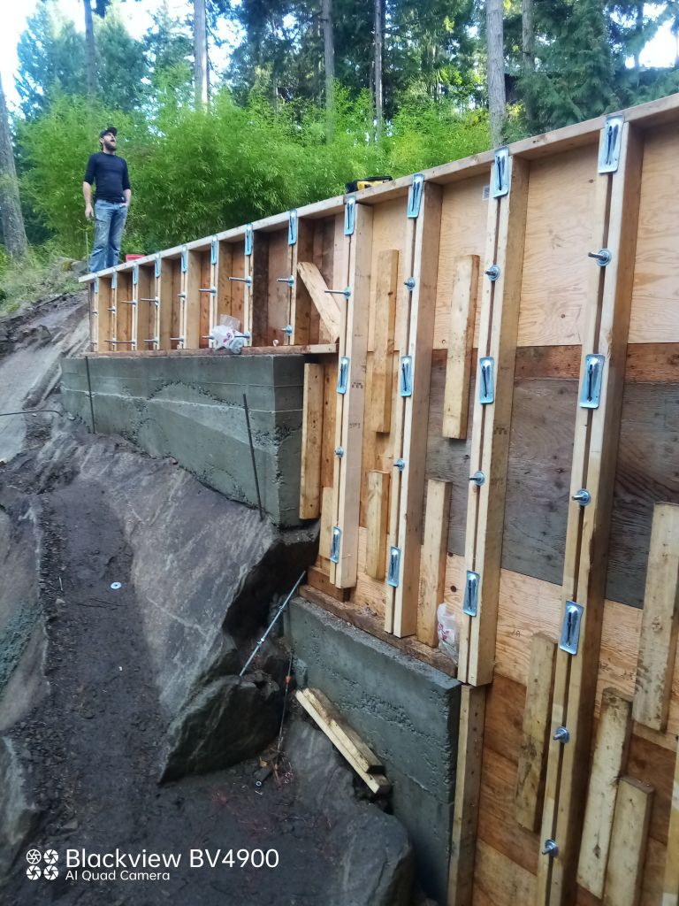 Concrete retaining wall — formed, poured, and stripped · Salt Spring Island