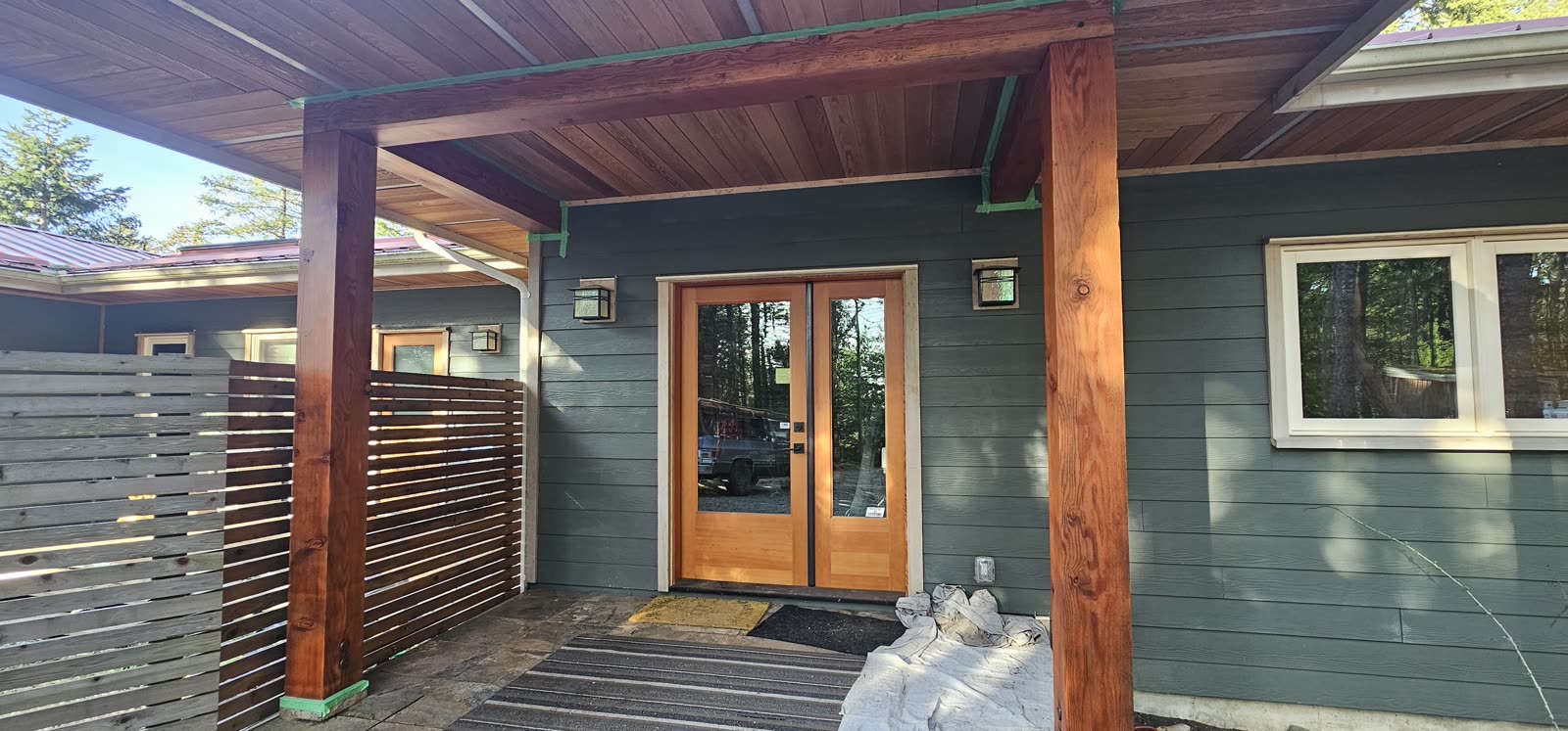 Covered cedar deck — entry elevation, cedar post framing · Saanich Peninsula