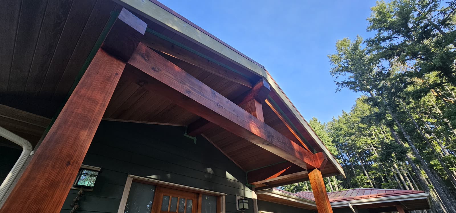 Cedar deck — covered soffit, board railing detail · Salt Spring Island