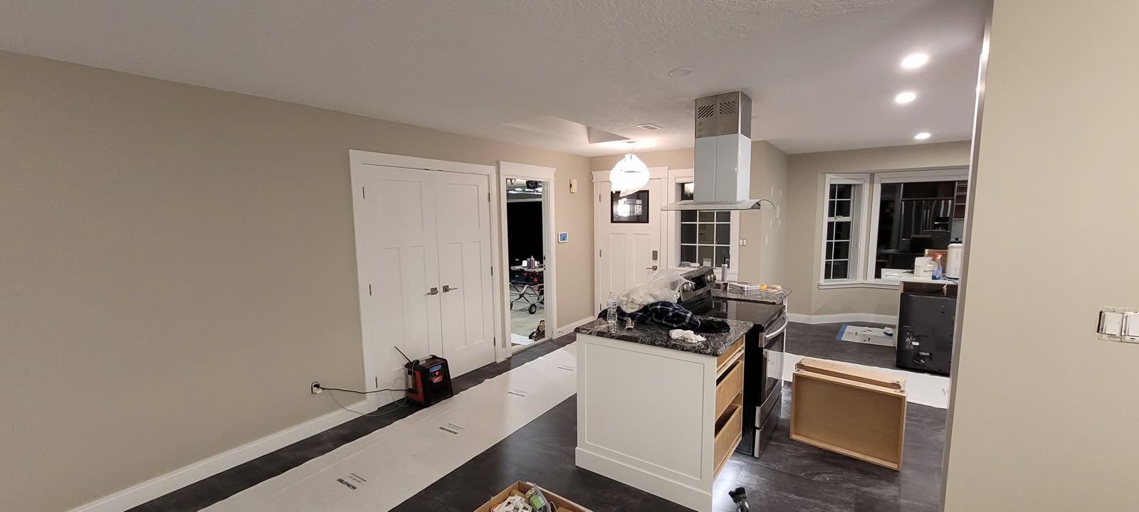 Kitchen with dark LVP flooring and island — View Royal renovation