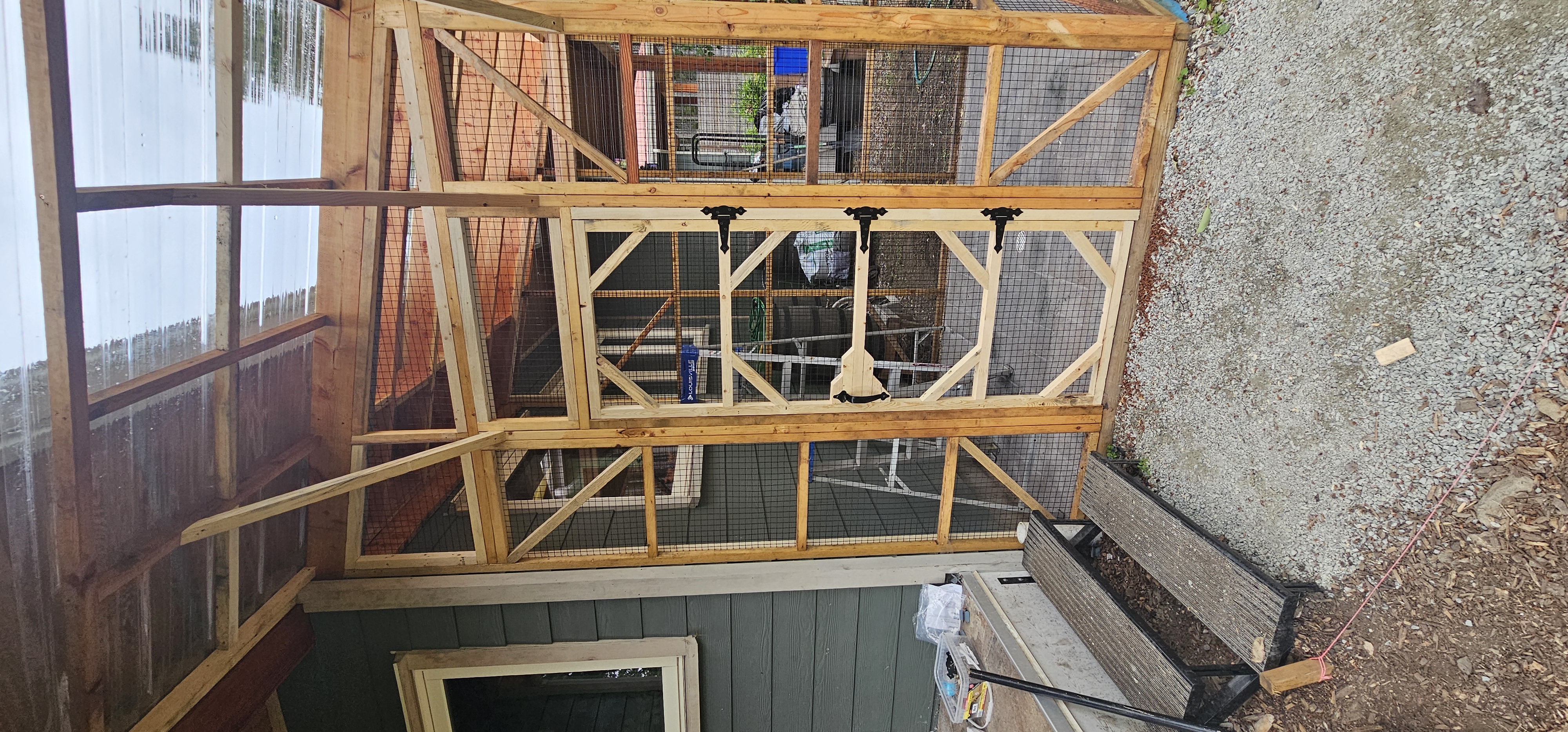Salt Spring Island project — cedar catio door with custom diagonal bracing and screen panels