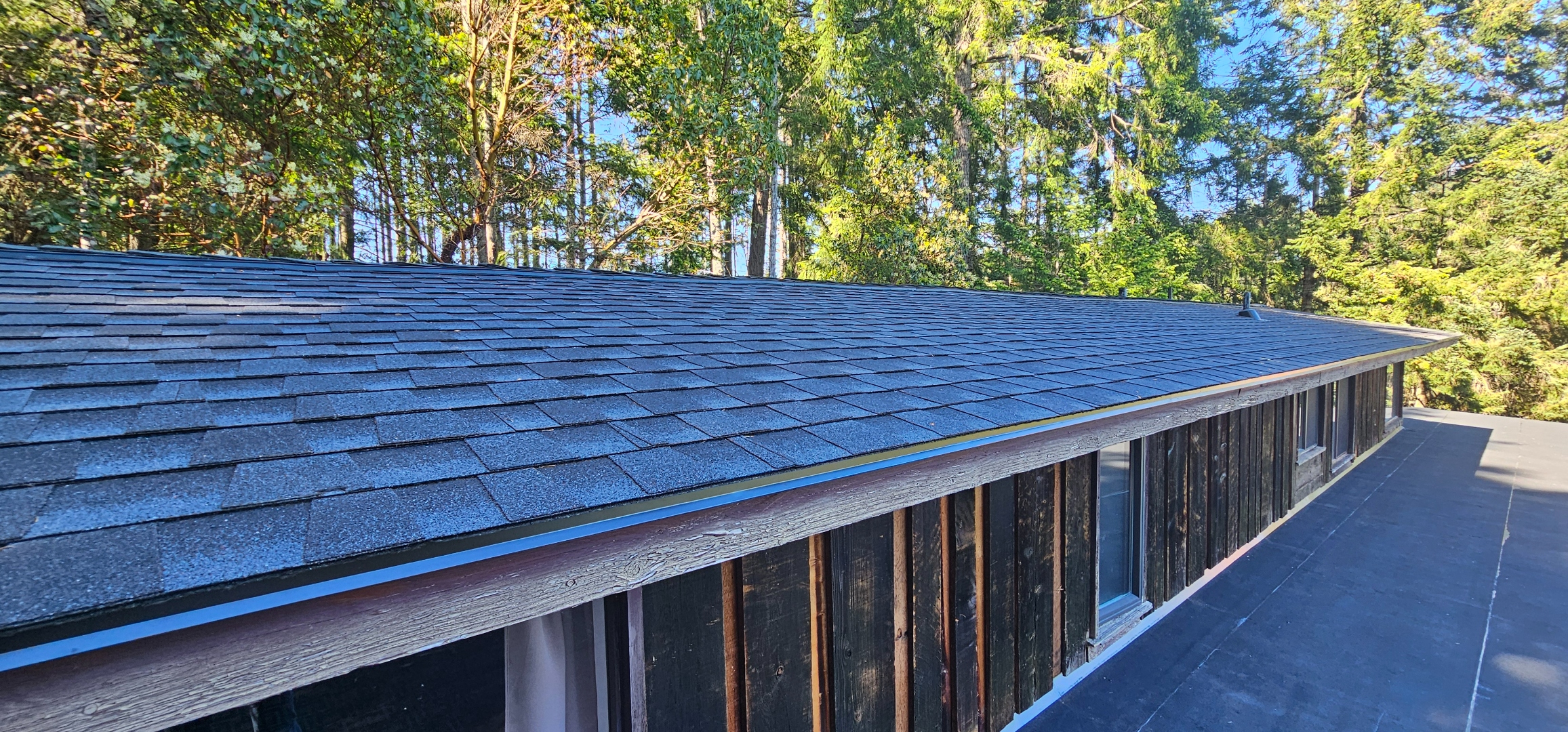 Torch-on flat roof — completed 2-ply SBS membrane, full length, Salt Spring Island