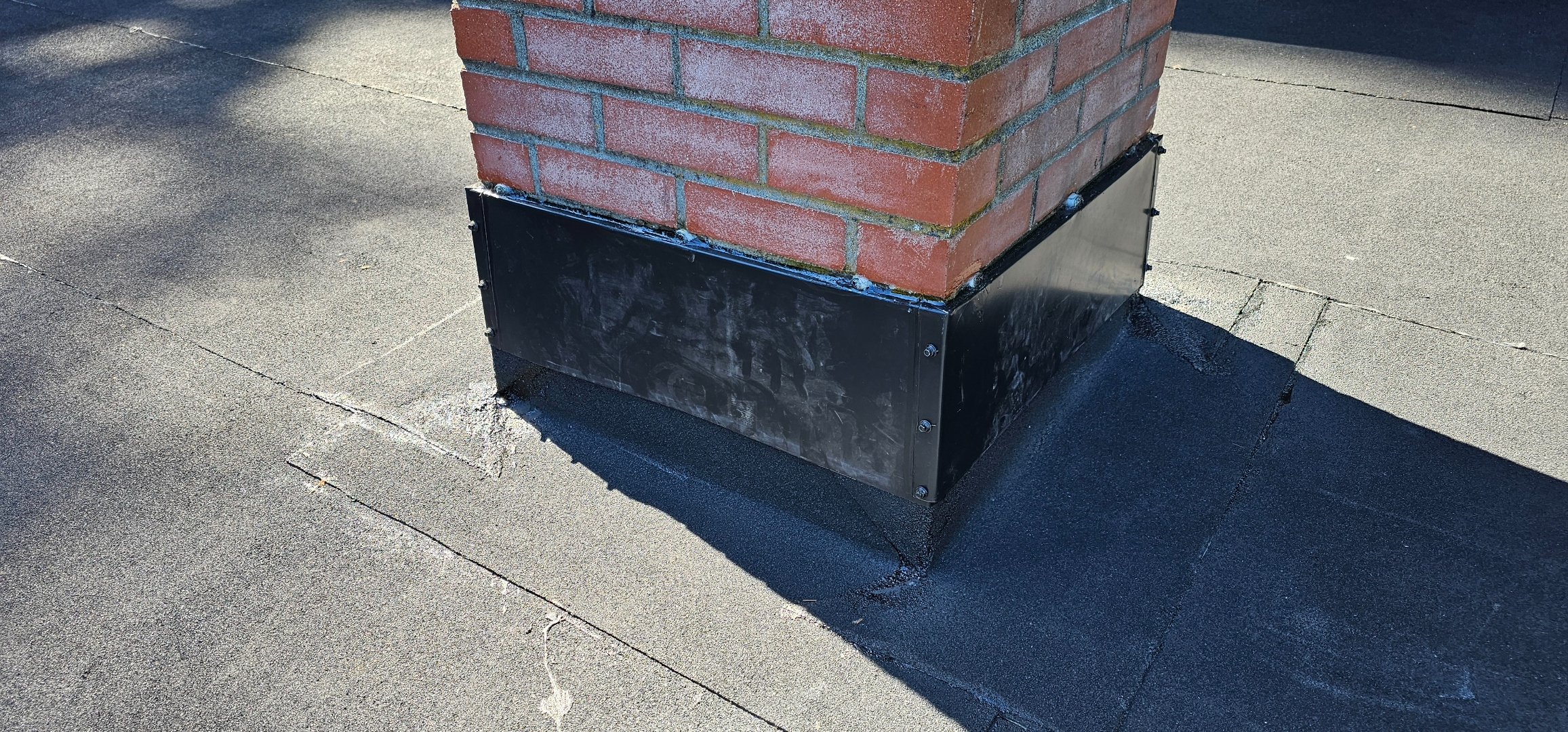 Chimney flashing collar — custom metal, finished torch-on membrane, clean sun angle