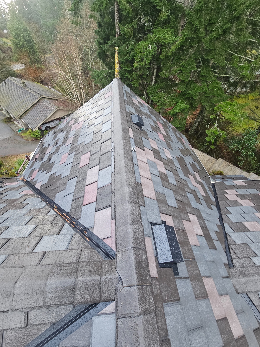 EnviroSlate Victorian roof — looking down from peak, heritage finial, complex hip geometry
